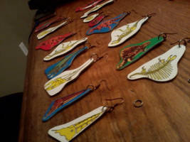 Upcycled dino earrings. by ChemicalBlaze